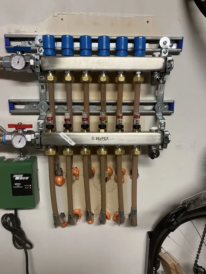 Plumber performing Water Heater Repair at a residential property in Dulles Town Center